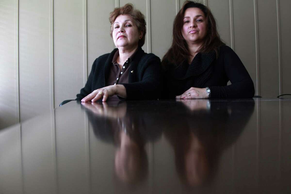 Carmina Figueroa, sitting next to daughter Marlene Yazar, is being sued by Harris County Sheriff's Deputy Brady Pullen in the aftermath of a shooting at her home that left her son in law - Yazar's husband - dead.