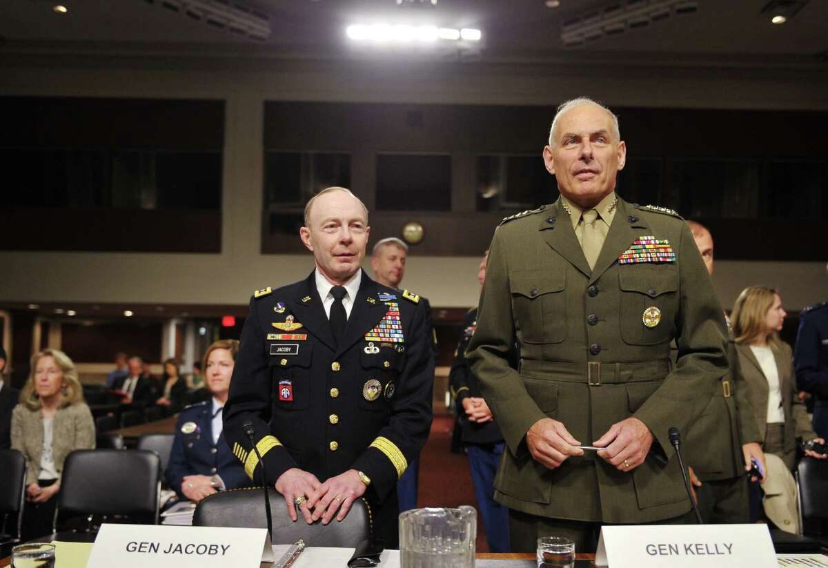 Marine Corps General John Kelly (R), commander of the US Southern Command, stands next to Army General Charles Jacoby (L), commander of the US Northern Command and commander of the North American Aerospace Defense Command, before taking their seates to testify to the Senate Armed Services Committee hearing on United States Northern Command and United States Southern Command in review of the Defense Authorization Request for FY2015 on March 13, 2014 on Capitol Hill in Washington, DC. AFP PHOTO/Mandel NGANMANDEL NGAN/AFP/Getty Images