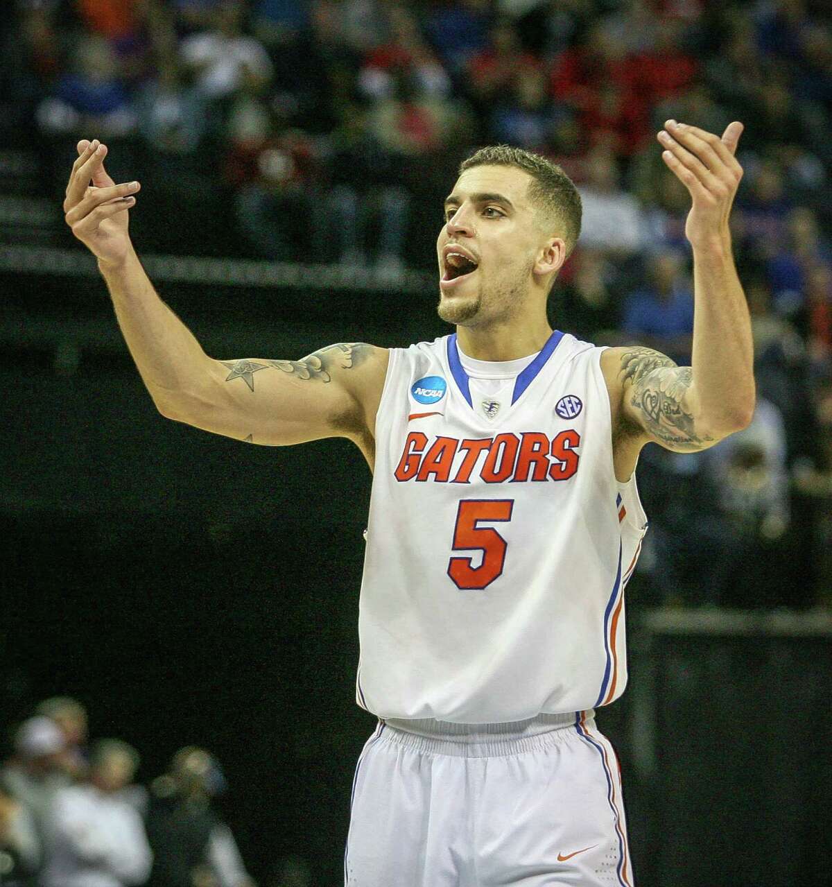 Florida's Scottie Wilbekin enjoys the moment as the clock winds down on the Gators' win over Dayton.