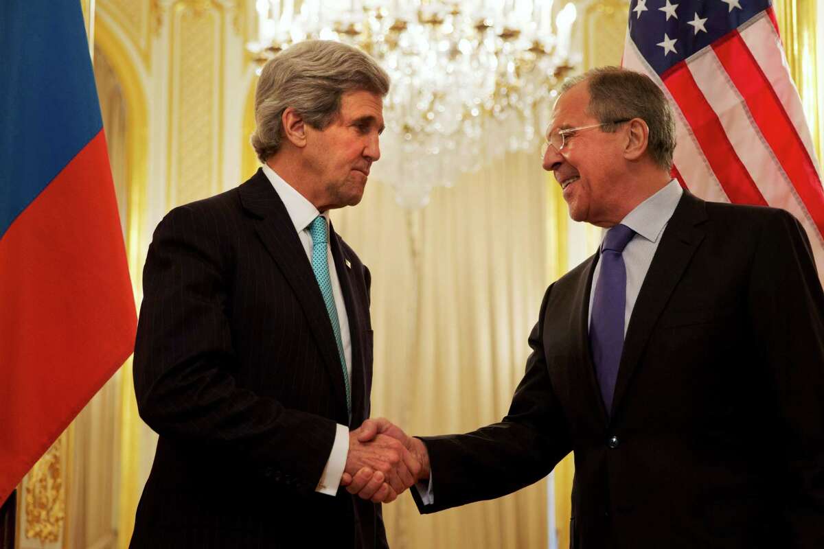 U.S. Secretary of State John Kerry, left, shakes hands with Russian Foreign Minister Sergey Lavrov before the start of their meeting at the Russian Ambassador's residence about the situation in Ukraine, in Paris Sunday March 30, 2014. Kerry traveled to Paris for a last minute meeting with Lavrov. (AP Photo/Jacquelyn Martin, Pool)