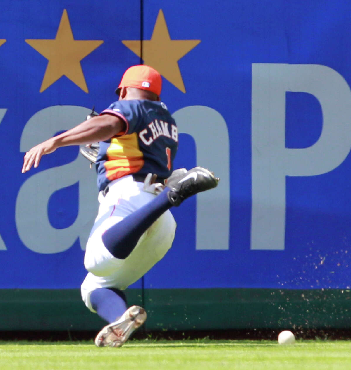 Center fielder Adron Chambers fails to come up with a hit by Veracruz's Jose Castillo in Sunday's 6-1 Astros victory in the exhibition finale.