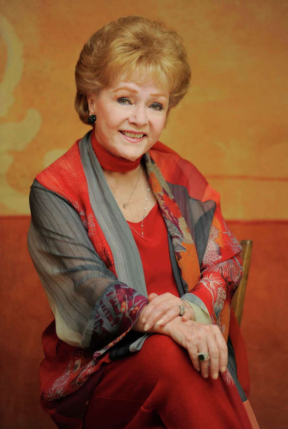 In this Tuesday, May 21, 2013 photo, Debbie Reynolds, a cast member in the film "Behind the Candelabra," poses for a portrait in Beverly Hills, Calif. Reynolds plays Frances, the mother of the pianist and vocalist, Liberace. HBO debuts AA?“Behind the CandelabraAA?” in the US, Sunday, May 26, 2013. (Photo by Chris Pizzello/Invision/AP)