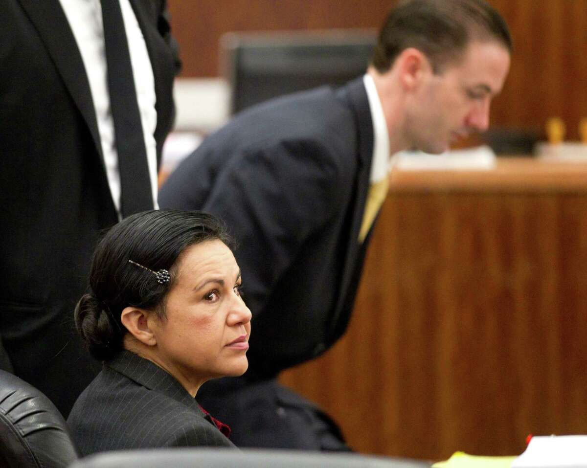 Ana Lilia Trujillo, left, sits in the courtroom before opening arguments in her trial Monday,March 31, 2014, in Houston. Trujillo, 45, is charged with murder, accused of killing her 59-year-old boyfriend, Alf Stefan Andersson, at his Museum District high-rise condominium in June 2013.