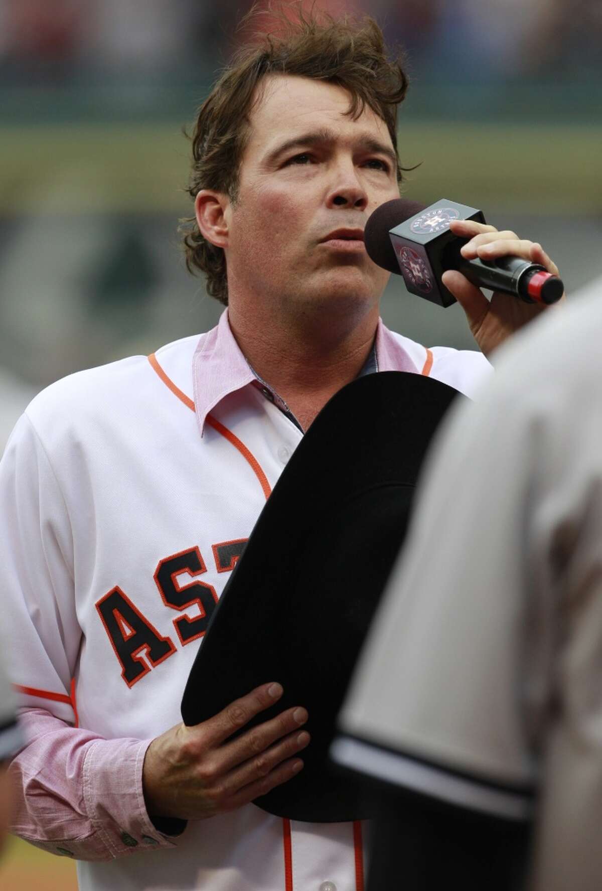 Clay Walker, shown singing the National Anthem at Minute Maid Park in April, is famous for such hits as "She Won't Be Lonely Long."