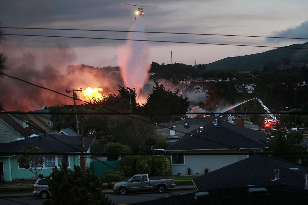 Firefighters try to dowse fires caused by an explosion on Claremont street in San Bruno, Calif., on Thursday, September 9, 2010.