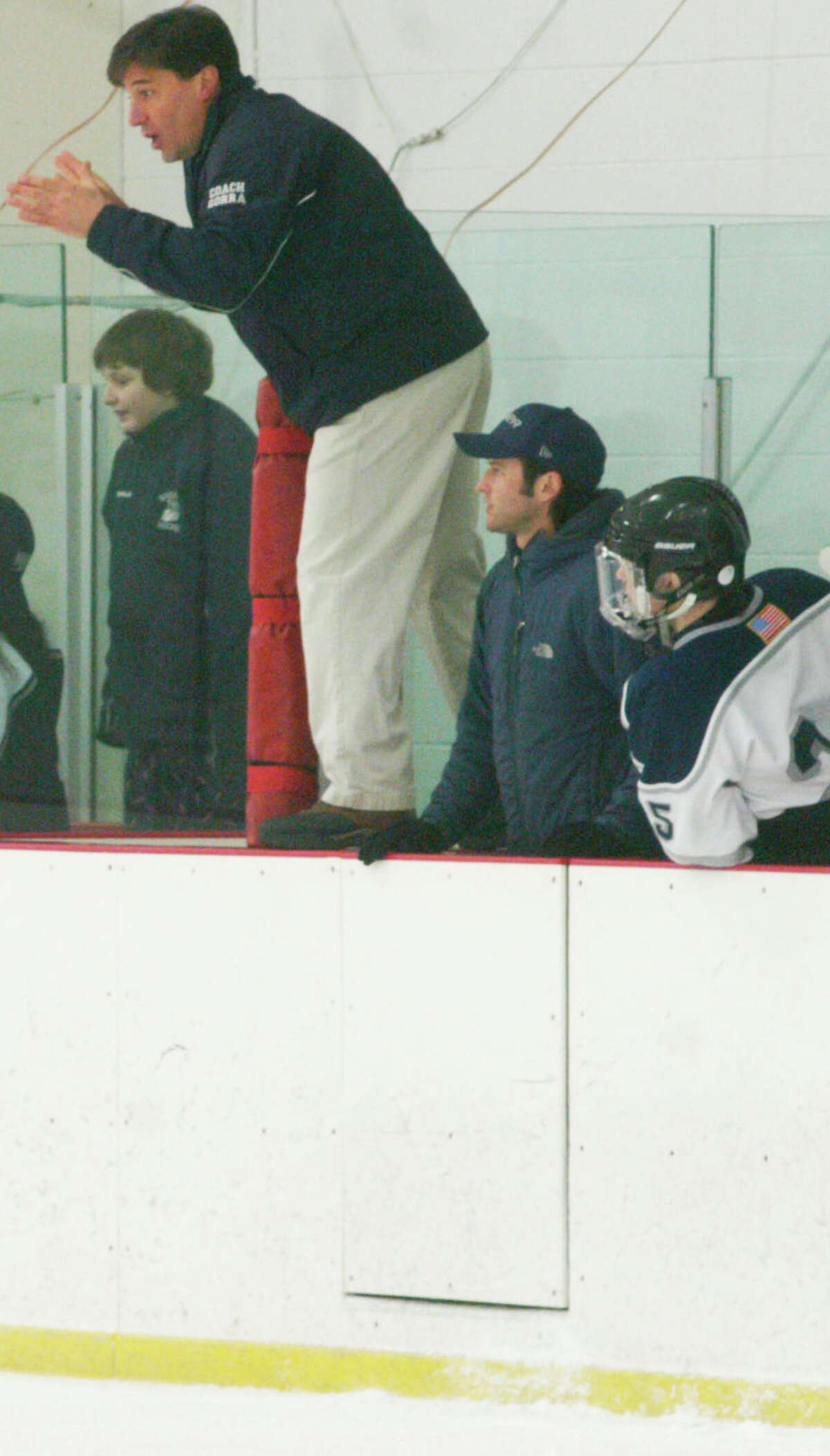 Spartan coach Michael Gorra all but checks himself into the match as the action heats up during Shepaug Valley/Litchfield/Nonnewaug ice hockey's Senior Night defeat to arch-rival Housatonic Valley/Northwestern/Wamogo at The Gunnery in Washington, Feb. 24, 2014.