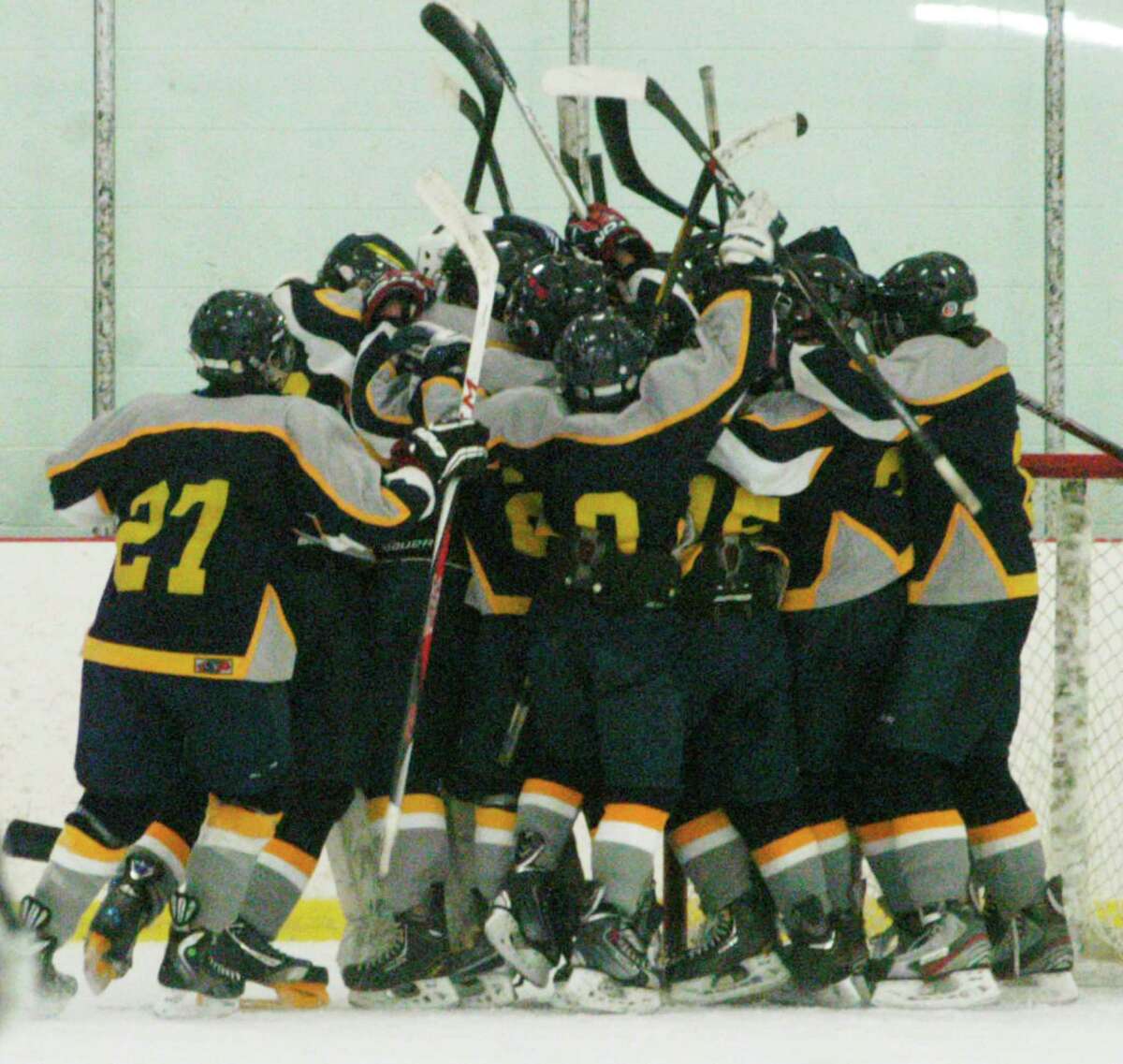 The Mountaineers celebrate victory following Shepaug Valley/Litchfield/Nonnewaug ice hockey's Senior Night defeat to arch-rival Housatonic Valley/Northwestern/Wamogo at The Gunnery in Washington, Feb. 24, 2014.