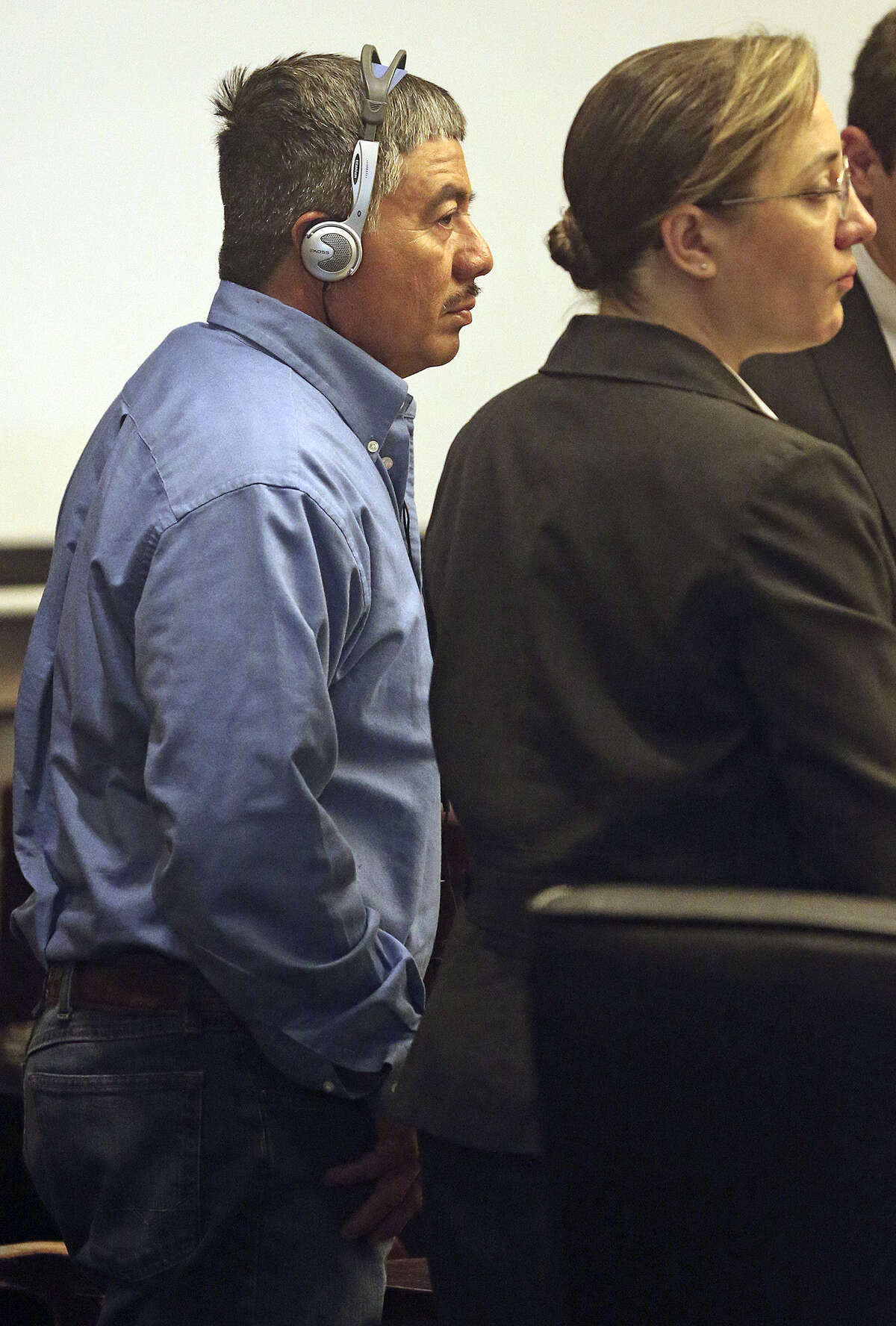 Paulino Flores, listening to an interpreter as his murder trial gets underway, is accused of firing an AK-47 at a group of men on a South Side property in 2010, killing one of them, Pedro Hernandez, 49. His attorney said Flores mistakenly believed that the men were trespassing on his land.