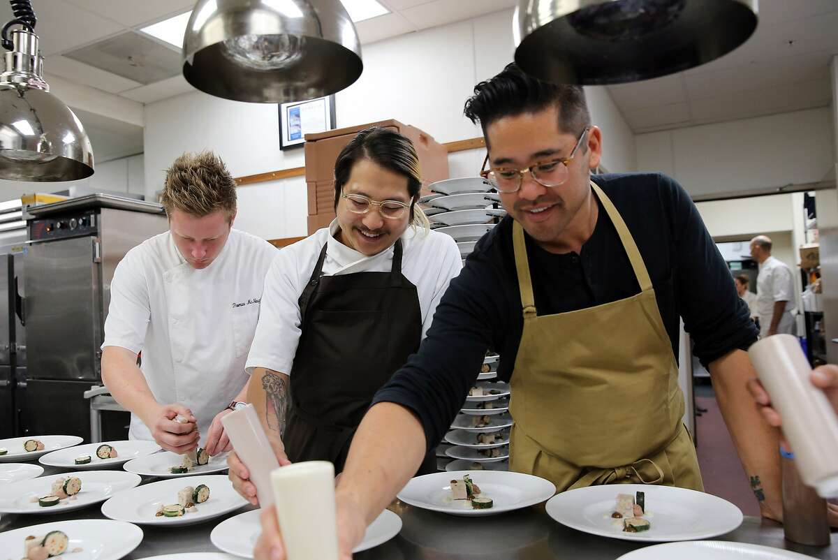 Thomas McNaughton of Flour + Water, Danny Bowien of Mission Chinese Food and Brandon Jew (left to right) work on plating a dish while participating in the James Beard Foundation's Taste America benefit dinner at the St. Regis in San Francisco, Calif., on Friday, October 4, 2013.