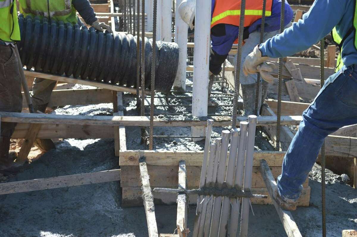 6-story cross and water wall going up at major Houston highway intersection