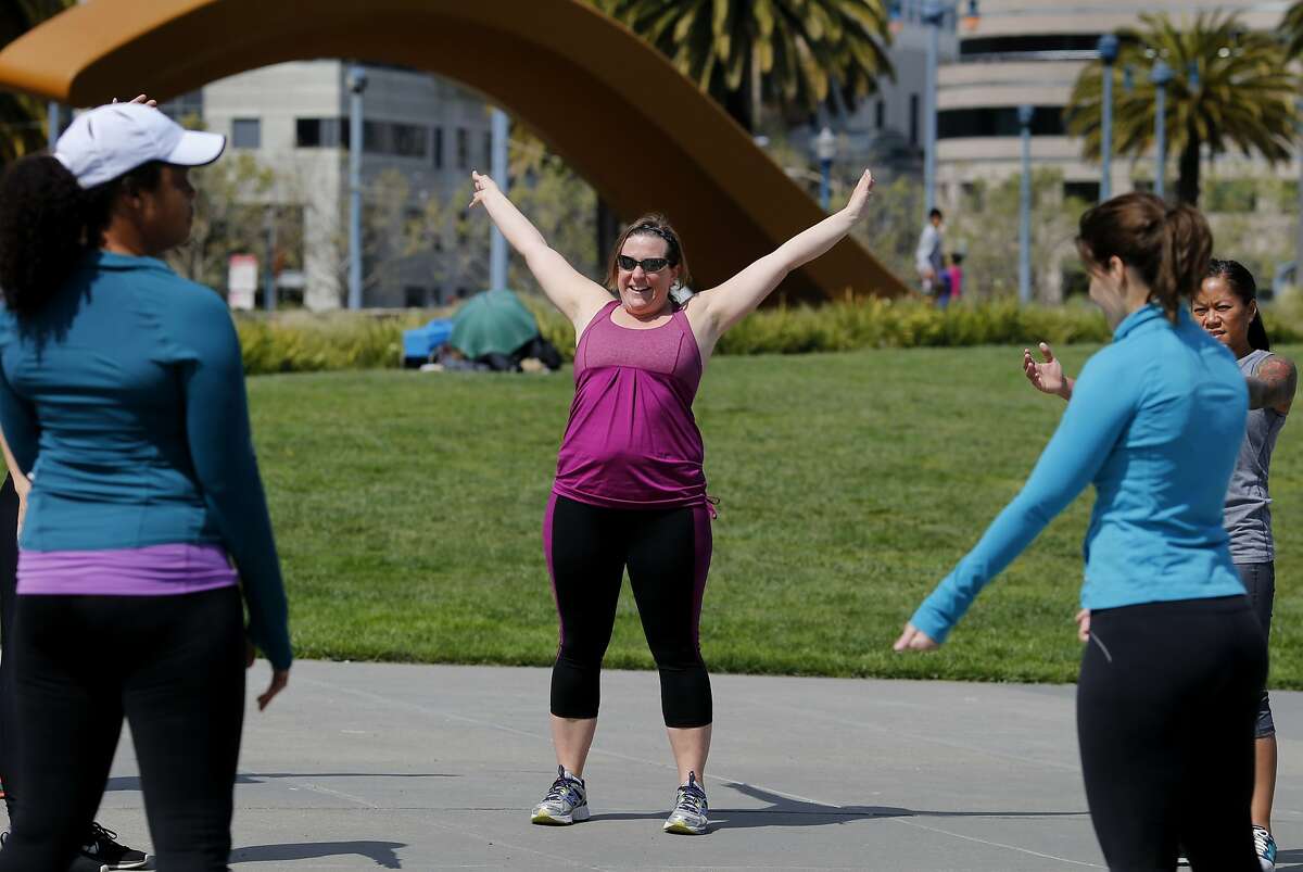 Emily D'Aniello (center) and other Gap Inc. employees enjoyed a workout in the sun Thursday April 3, 2014 in San Francisco, Calif. Stanford University is conducting a diet study to determine why some people lose weight on certain diet programs while others don't. Employees at Gap Inc. can work out while near their corporate offices, at the foot of Folsom Street, on a daily basis.