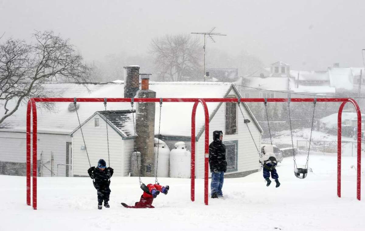 Swinging in Byram Park during the blizzard which closed schools and sent state and many local business workers home early Wednesday, Feb 10, 2010.