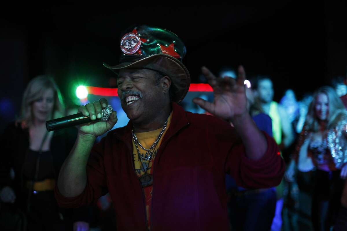David Miles Jr. leads the crowd in a line dance at the Church of 8 Wheels on Fillmore Street on March 19, 2014 in San Francisco, Calif. The Church of 8 Wheels is the brainchild of David Miles, Jr. and features roller skating several nights a week in a disused church at 554 Fillmore Street.