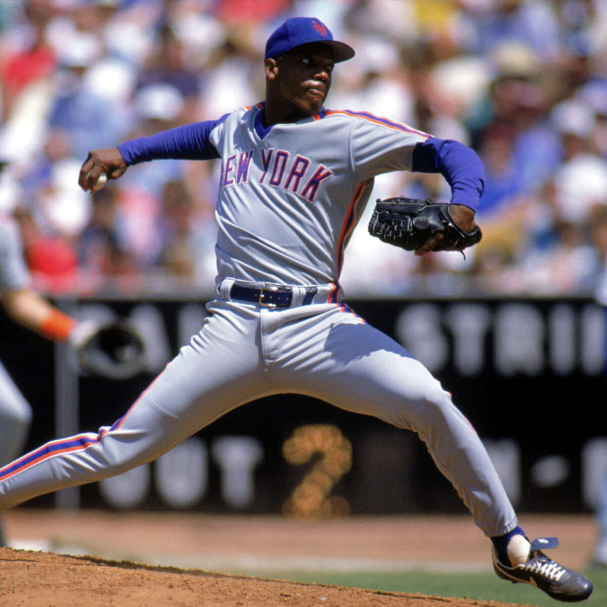 Former New York Mets pitcher Dwight Gooden throws during an Old