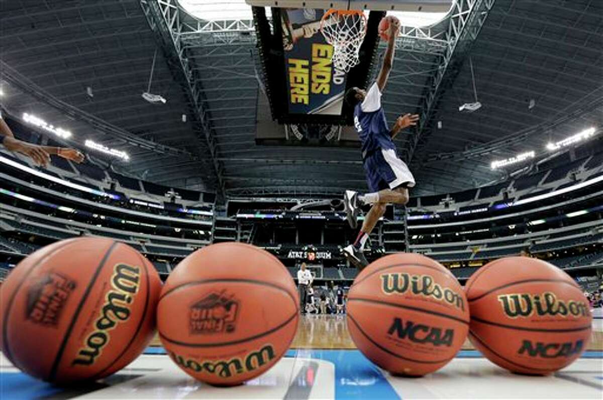 Connecticut forward DeAndre Daniels shoots the ball during team practice for their NCAA Final Four tournament college basketball semifinal game Friday, April 4, 2014, in Dallas. Connecticut plays Florida on Saturday, April 5, 2014. (AP Photo/Eric Gay)