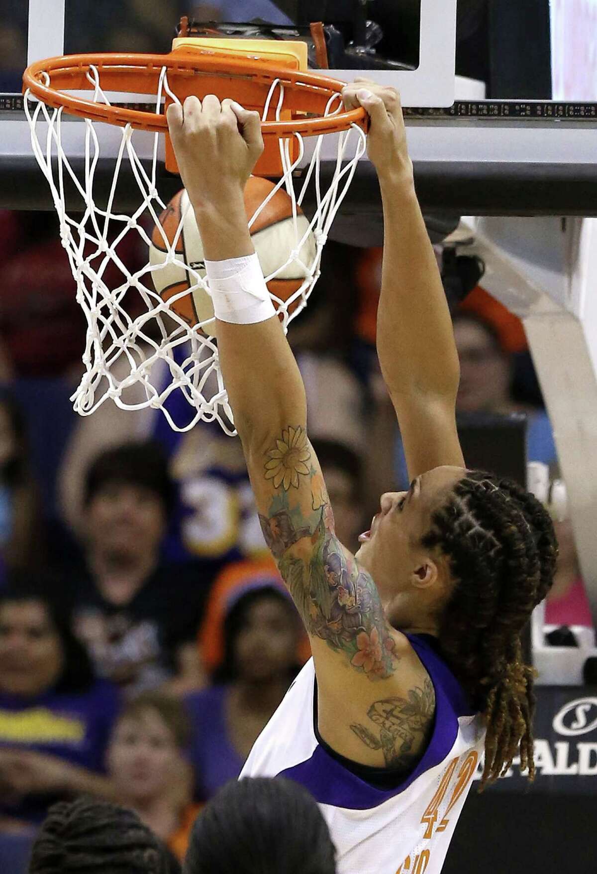 Phoenix Mercury's Brittney Griner goes in for a break away dunk against the Chicago Sky in the second half during a WNBA basketball game on Monday, May 27, 2013, in Phoenix. The Sky defeated the Mercury 102-80. (AP Photo/Ross D. Franklin)
