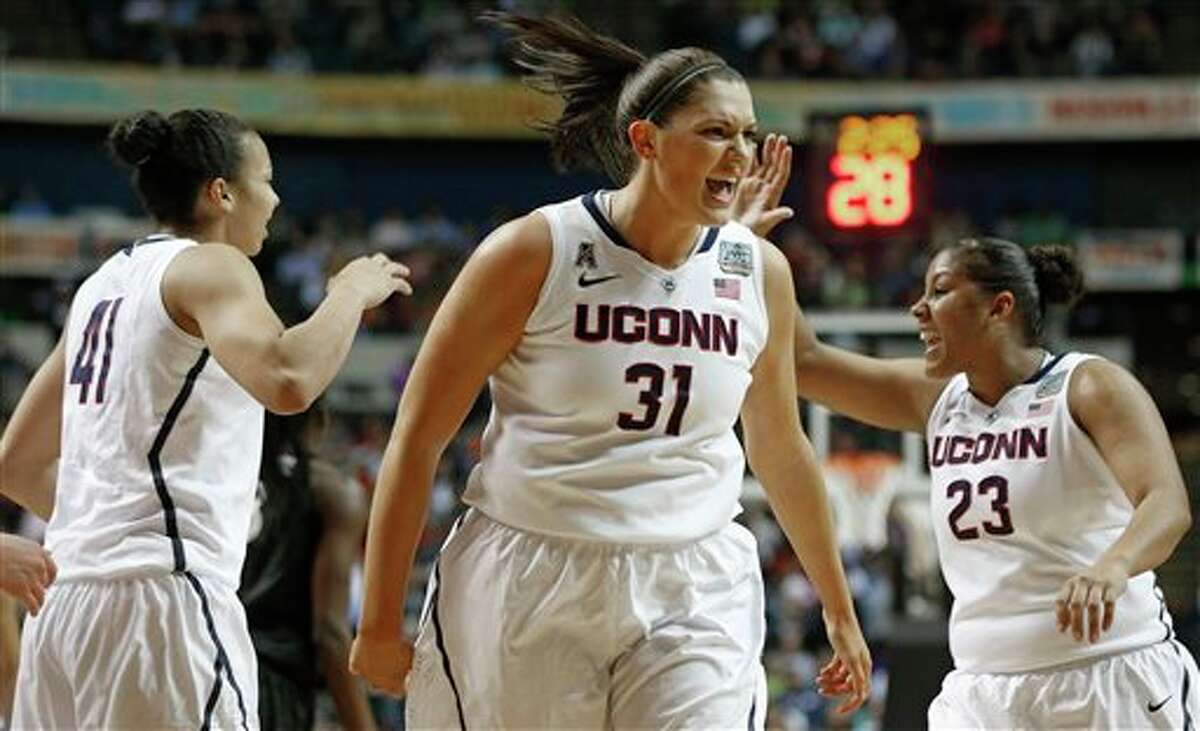 Connecticut center Stefanie Dolson (31) celebrates against Stanford during the first half of the semifinal game in the Final Four of the NCAA women's college basketball tournament, Sunday, April 6, 2014, in Nashville, Tenn. (AP Photo/John Bazemore)