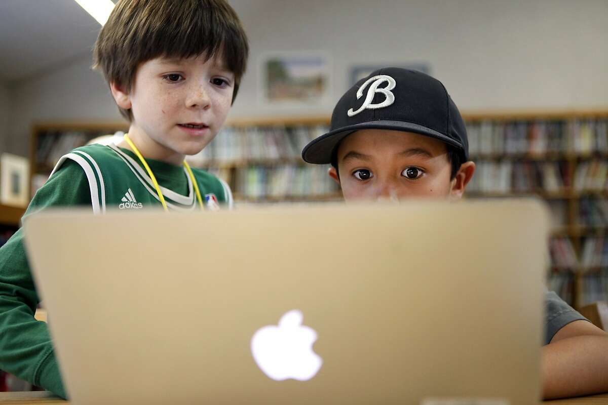 Second grade students Cole Donnelly, left, and James Bonneau work ona lesson during Codekids, an after school computer science class at Old Mill School in Mill Valley, CA, Tuesday, March 18, 2014.