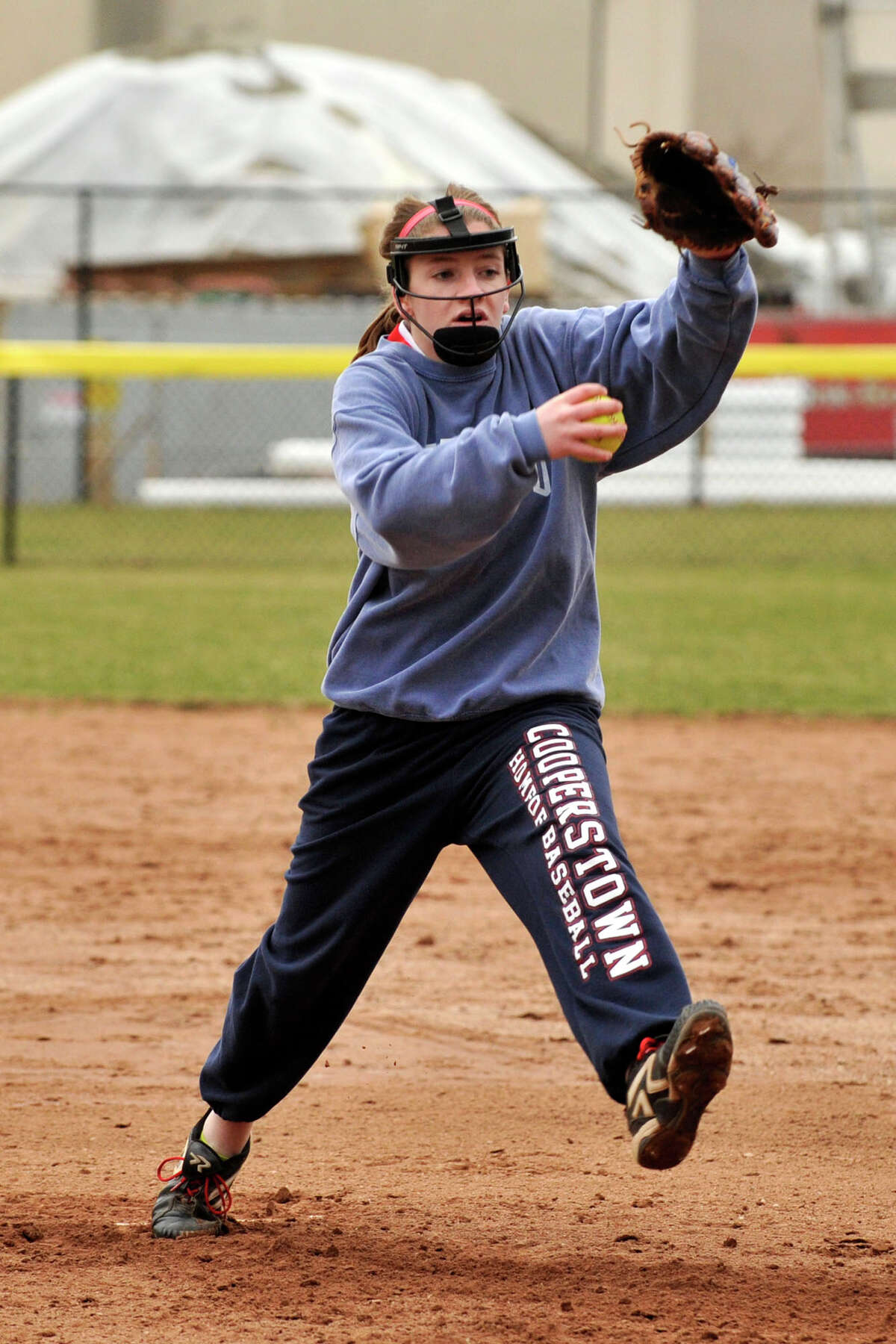Katie Piro pitches during softball practice at Greenwich High School in Greenwich, Conn., on Monday, April 7, 2014.