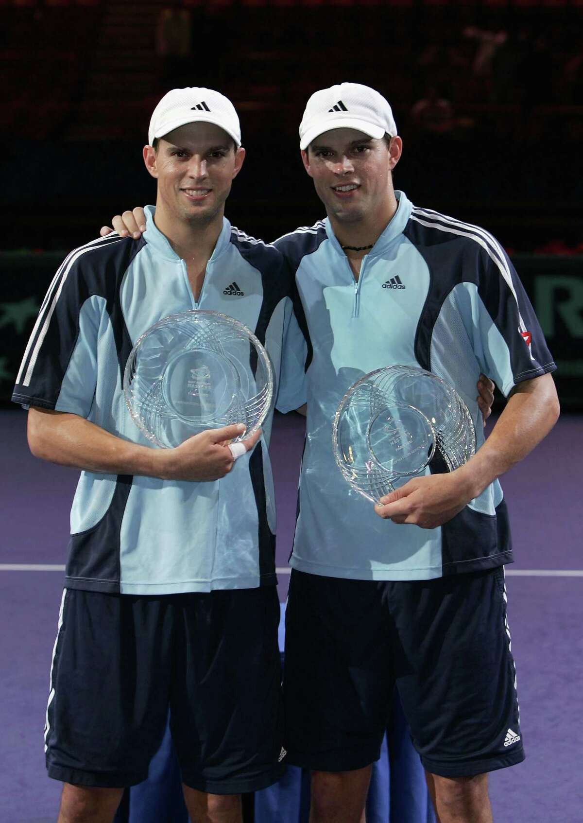 PARIS - NOVEMBER 6: Bob and Mike Bryan of the USA hold their trophies after victory against Mark Knowles of the Bahamas and Daniel Nestor of Canada in the final ,during the BNP Paribas ATP Masters Series at the Palais Omnisports Paris-Bercy, November 6, 2005 in Paris, France. (Photo by Clive Brunskill/Getty Images) *** Local Caption *** Bob Bryan;Mike Bryan