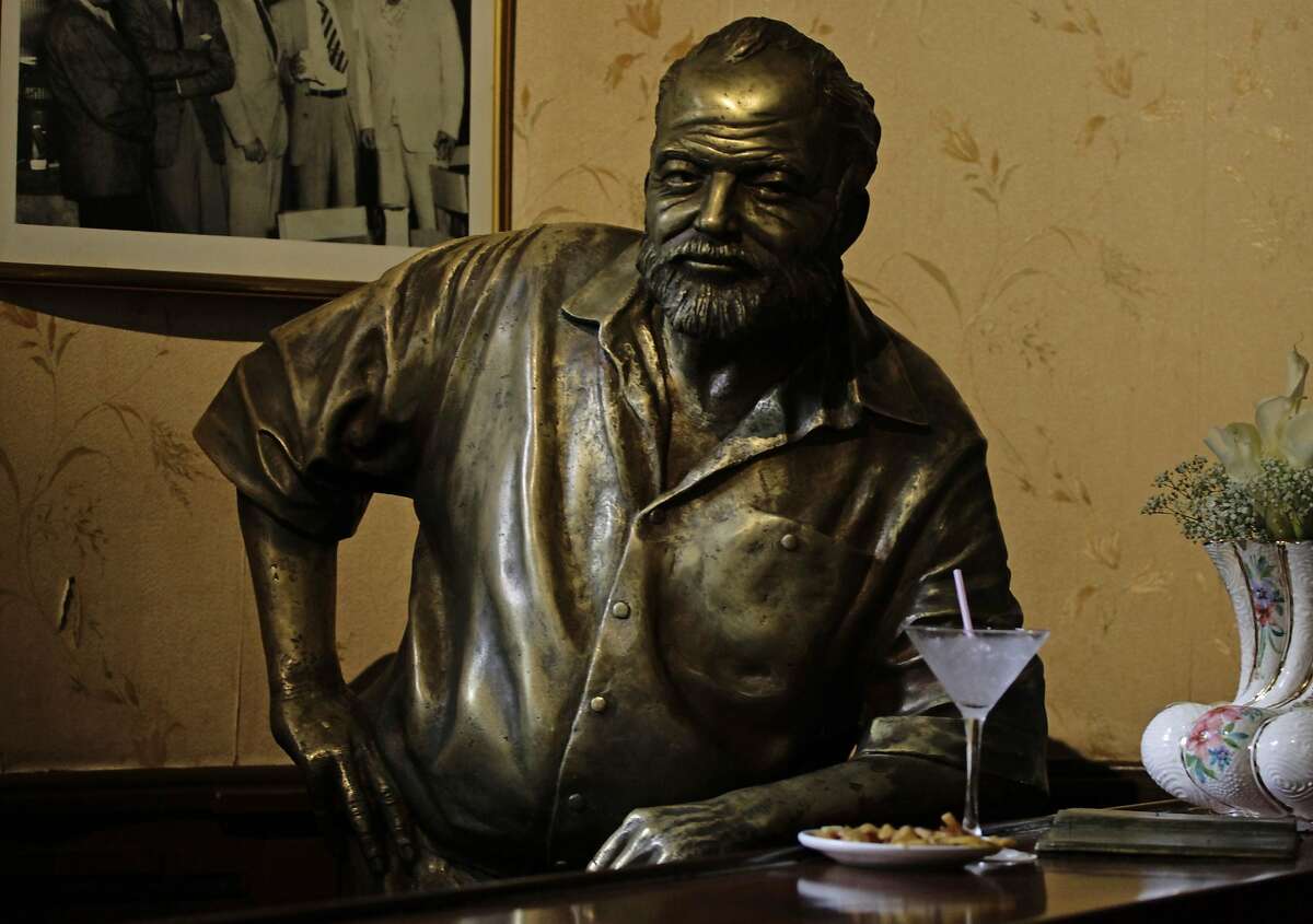 A bronze statue of late Nobel-prize winning author Ernest Hemingway is seen at the 'Floridita' bar in Havana in this July 2, 2011 file photo. For a writer who explored the world of men without women, Hemingway certainly liked to have women around him. The Nobel Prize-winning author had four wives in all with barely a day between each changeover, as well as friendships with Ava Gardner, Ingrid Bergman and Marlene Dietrich. Now a fictionalized account of the marriages, inspired by his letters, examines what it might have been like to be the wives. "We think of him as a womanizer, we don't think of him as a husband. That's a role that's subservient to the big-game hunter, the deep-sea fisherman, the war correspondent," said Naomi Wood, whose novel "Mrs Hemingway" has just been published. To match BOOKS-HEMINGWAY/WOMEN REUTERS/Desmond Boylan/Files (CUBA - Tags: SOCIETY MEDIA)