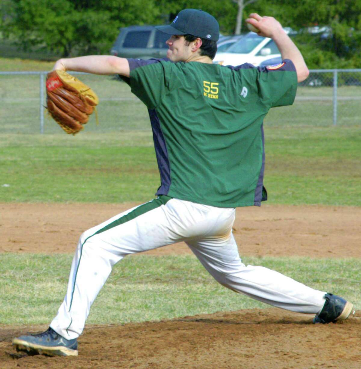 Matt Ryan of the Green Wave delivers a pitch in relief during a pre-season scrimmage for New Milford High School baseball, April 2014