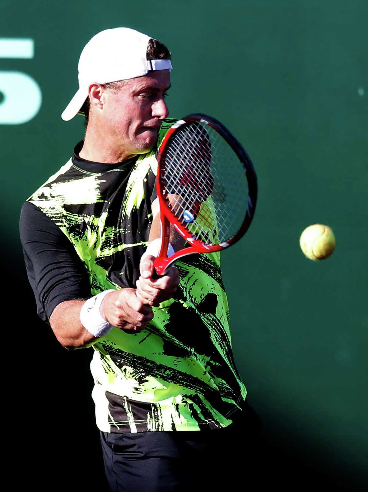 Lleyton Hewitt gets his bearings on the clay surface en route to beating Peter Polansky in a three-setter.