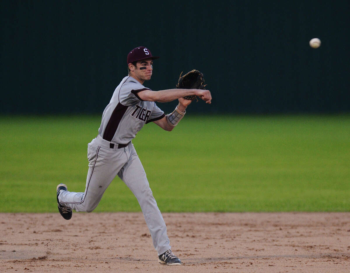 Silsbee's Jordan Gore, No. 5, throws for first base during Tuesday's game against Buna. Silsbee played against Buna at Silsbee High School on Tuesday evening. Photo taken Tuesday, 4/8/14 Jake Daniels/@JakeD_in_SETX
