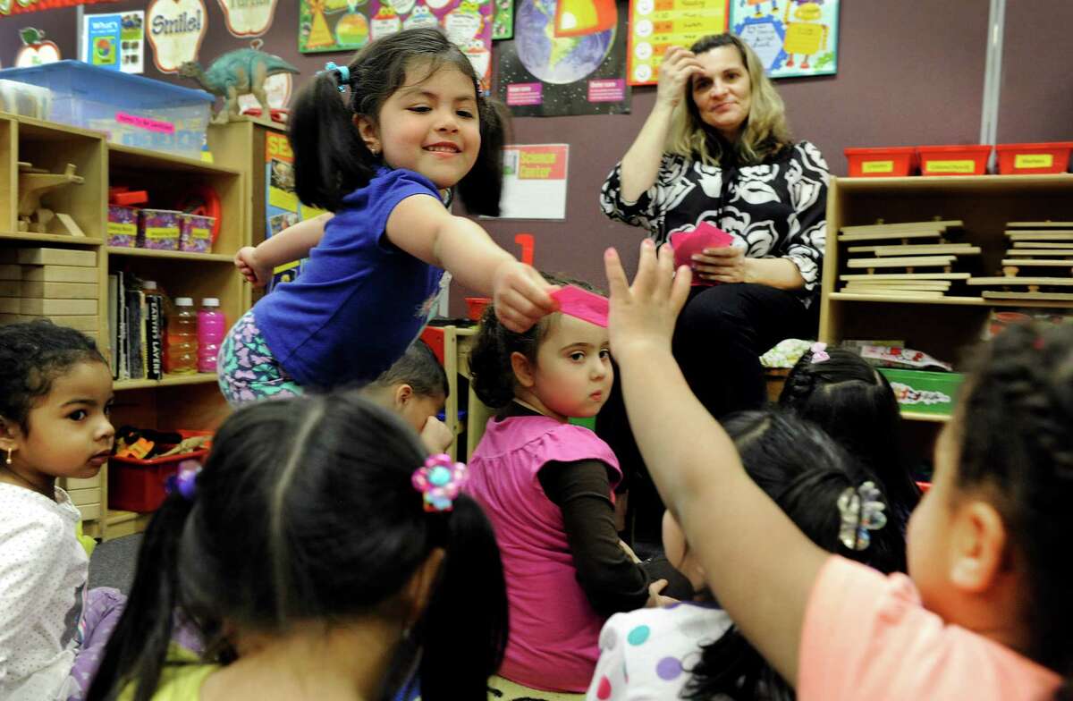 Brittney Garcia, 4, partcipates in an exercise that teaches children to recognize numbers at the Salvation Army - The Right Place, a pre-school funded by the state school readiness grant the city receives, Wednesday, April 9, 2014.