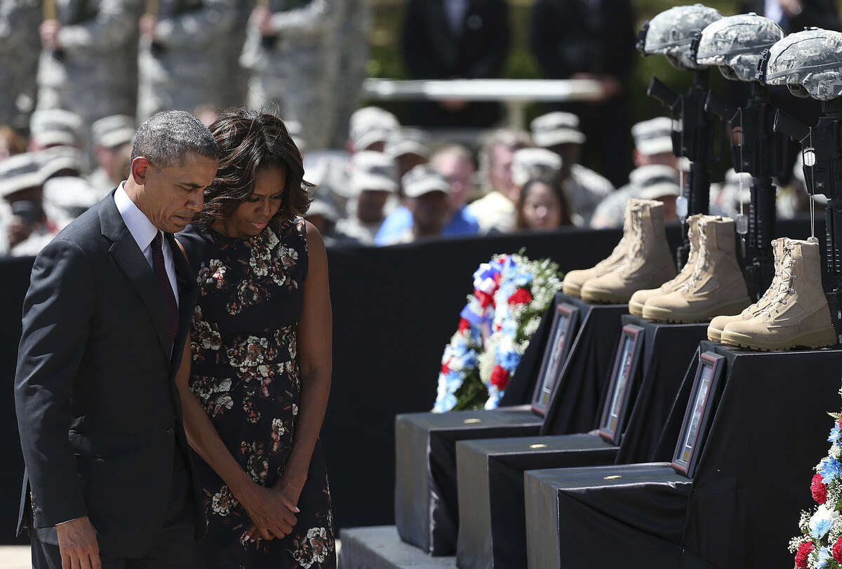 President Barack Obama and first lady Michelle Obama pay their respects at a memorial to the three soldiers slain during a shooting rampage April 2 at Fort Hood. The gunman, Spc. Ivan Lopez, also killed himself.