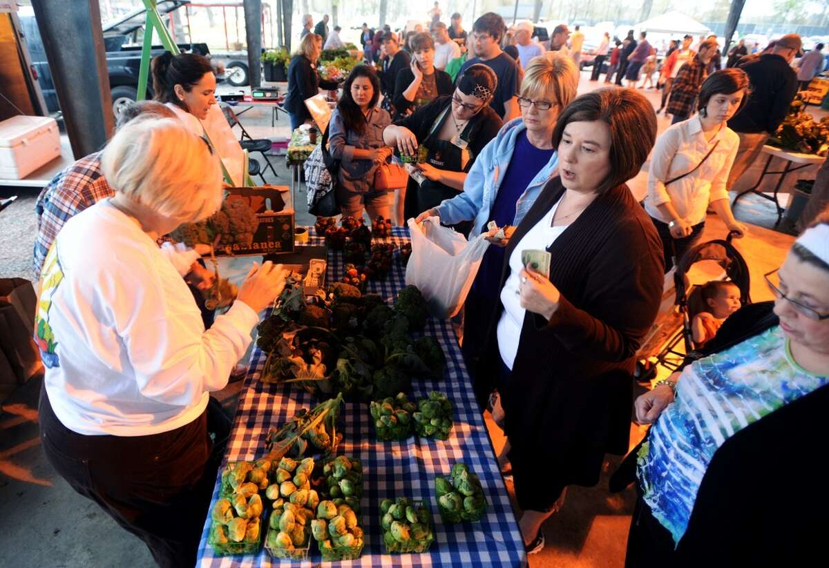 Customers line up for fresh produce at the Beaumont Farmer's Market on Saturday morning. The Beaumont Farmer's Market opened for business at the Beaumont Athletic Complex on Saturday morning. Photo taken Saturday, 3/15/14 Jake Daniels/@JakeD_in_SETX