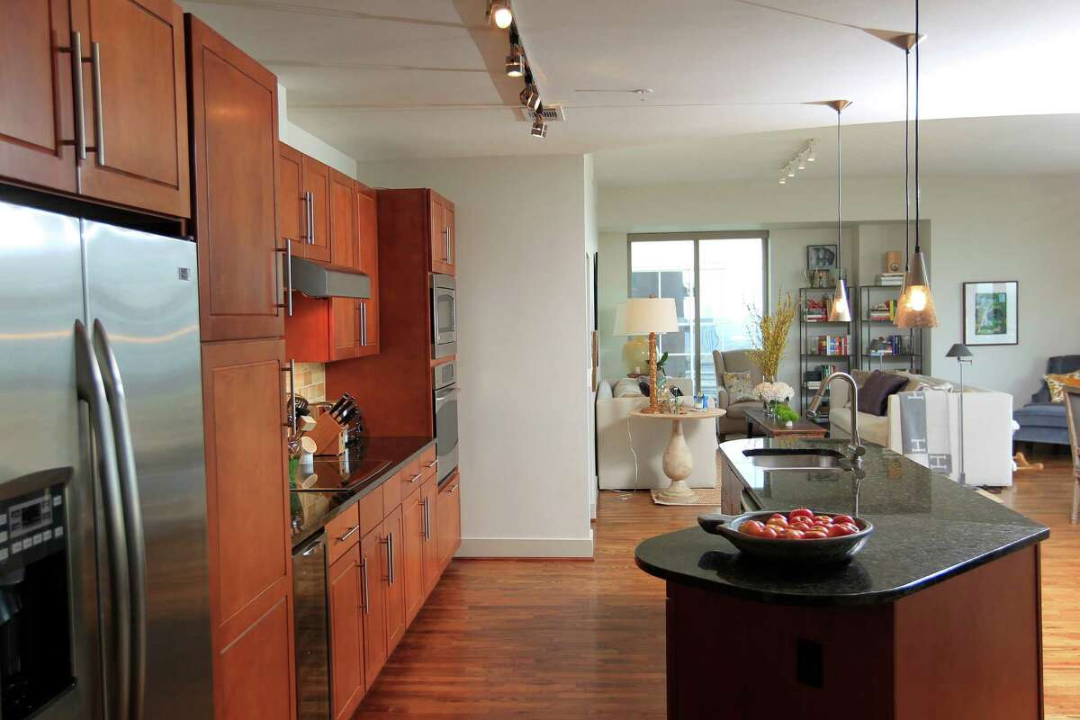 Image showcasing Houston family bucks tradition to create artful, high-rise abode