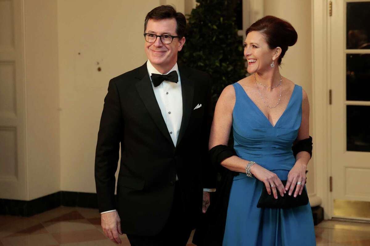 Actor and television host Stephen Colbert, left, and Evie Colbert arrive to a state dinner hosted by U.S. President Barack Obama and U.S. first lady Michelle Obama in honor of French President Francois Hollande at the White House on February 11, 2014.