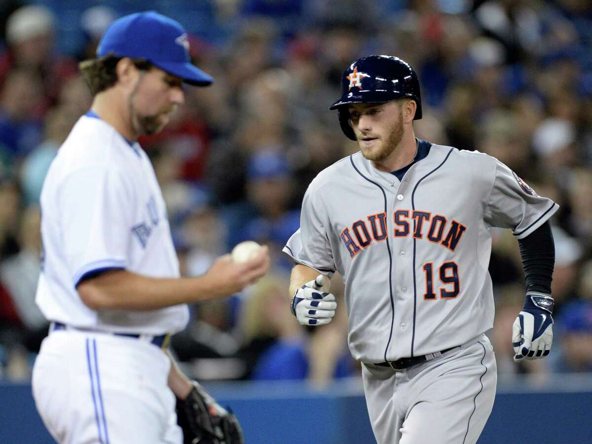 Astros left fielder Robbie Grossman rounds the bases after hitting his first homer of the season off Blue Jays starter R.A. Dickey.