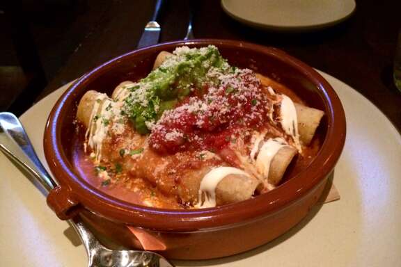 Mamacita: Enchiladas filled with slow-roasted chicken and topped with mole Amarillo ($18)