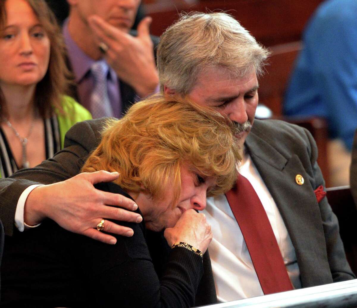 Mark Fusco's mother and father, Kim and Rick Fusco support each other during their son Mark's sentencing on charges of vehicular manslaughter Friday April 11, 2014 in Rensselaer County Court in Troy, N.Y. Fusco admitted to driving drunk and killing Sean Murphy. (Skip Dickstein / Times Union)