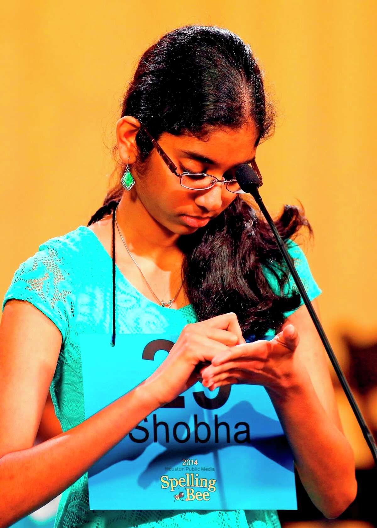 Pearland Junior High West's Shobha Dasari writes a word on her palm before spelling it aloud in the Houston PBS Spelling Bee March 29, where she placed as co-champion Pearland Junior High West's Shobha Dasari writes a word on her palm before spelling it aloud in the Houston PBS Spelling Bee March 29, where she placed as co-champion