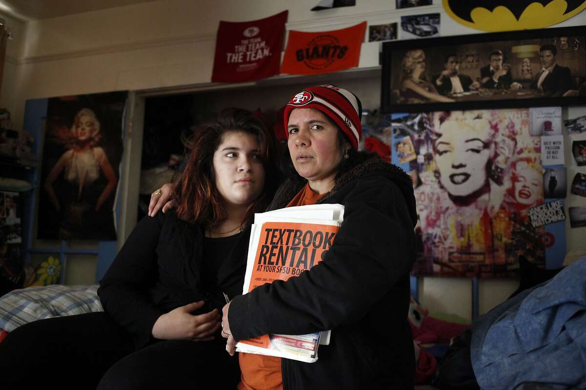 Blanca Reyes, right with her daughter Jacqueline stand in their apartment which they have had for 24 years in the Mission District, Thursday April 10, 2014, in San Francisco, Calif. They are fighting to stay their as the landlord is offering them $45,000 to leave.
