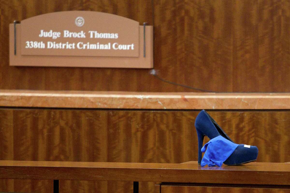 One of Ana Trujillo's shoes sits in front of District Court Judge Brock Thomas' bench before Trujillo is sentenced to life in prison for killing her boyfriend with the heel of a stiletto shoe Friday, April 11, 2014, in Houston. Trujillo was convicted in the brutal 2013 slaying of, Alf Stefan Andersson, using a 5-inch stiletto shoe.