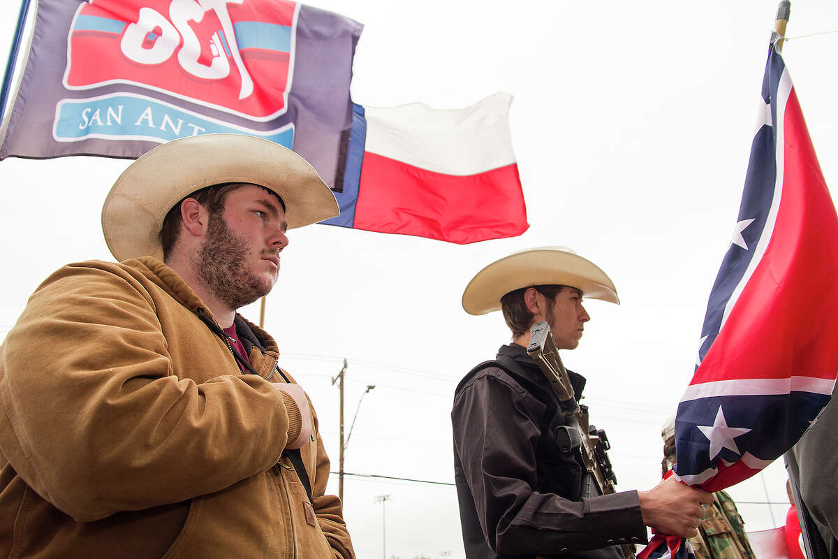 Michael Moody, left, and Mason Deering were among those rallying in support of Henry Vichigue, a San Antonio man and member of Open Carry Texas who was arrested by police while carrying a loaded rifle.