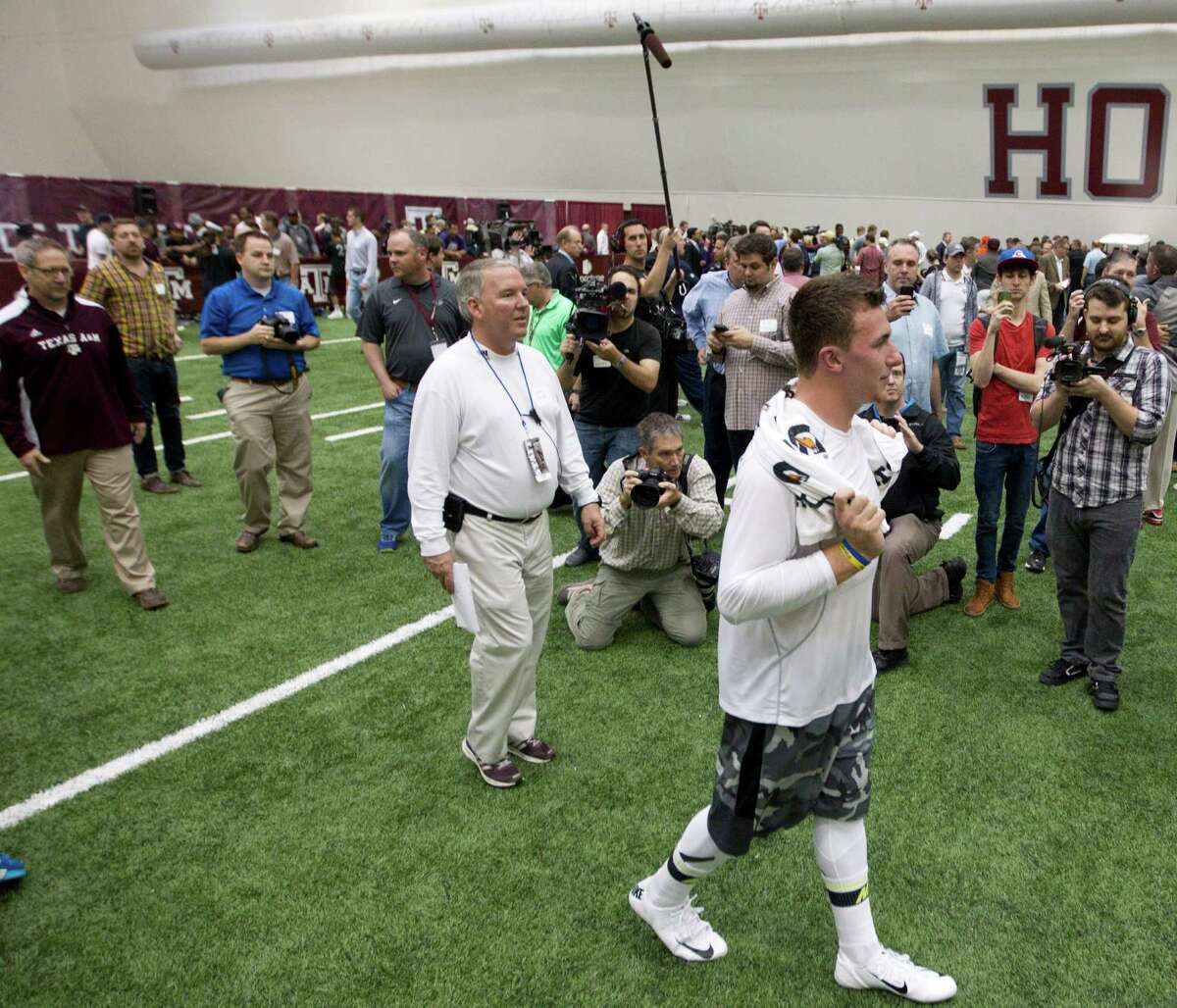 Johnny Manziel embraced the spotlight as Texas A&M's quarterback and drew quite the crowd for his his pro day in College Station on March 27.