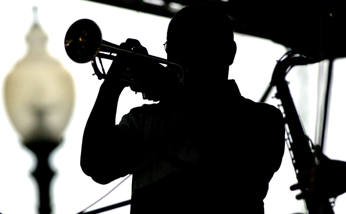 Jazz'SAlive: Annual jazz festival sponsored by the city and the San Antonio Parks Foundation. Sept. 20-22. Travis Park, 300 E. Travis St. Free admission. 210-212-8423 or www.saparks foundation.org. Shown:Cecil Carter of the Regency Jazz band plays the trumpet Sunday at the 20th anniversary of Jazz'SAlive at Travis Park. Rain persisted throughout the day, but hardcore jazz fans watched regardless.