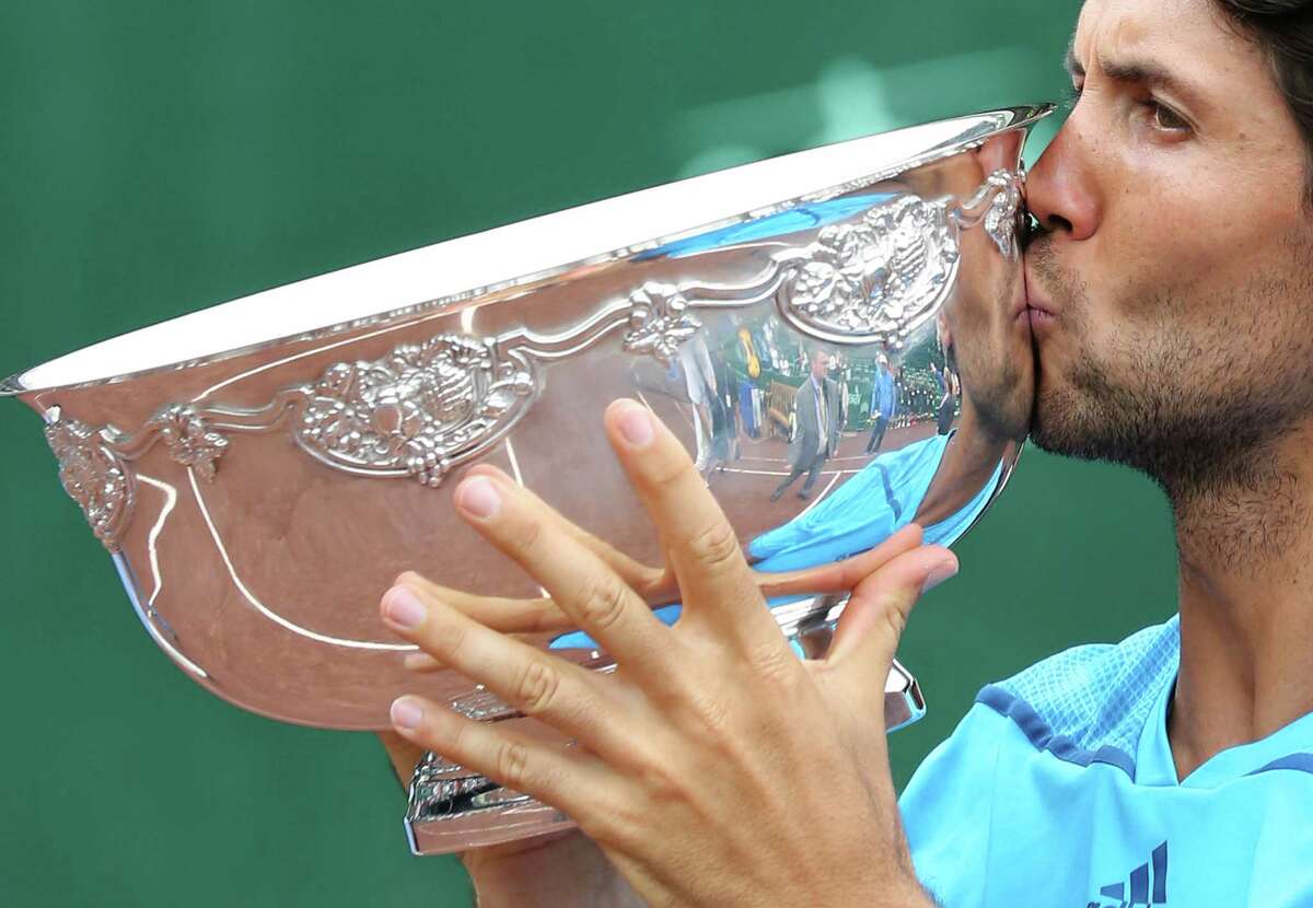 Fernando Verdasco (ESP) kisses the tropy after defeating Nicolas Almagro (ESP) ) 6-3, 76 in the singles finals on April 13, 2014 at the U.S. Men's Clay Court Championship at River Oaks in Houston, TX. .
