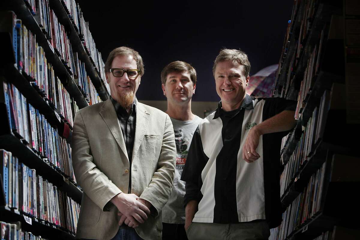 Kevin Hunsanger (l to r), Pete Mulvihill and Kevin Ryan, co-owners of Green Apple Books and Music, pose for a portrait at Le Video on Monday, April 14, 2014, in San Francisco, Calif.