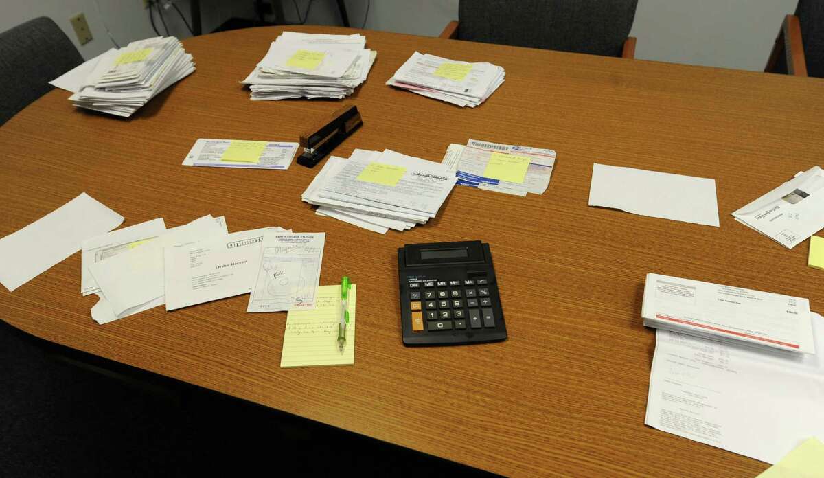 Paper work is spread out on a table at Jordan & Savoy certified public accountants office on Monday, April 14, 2014 in Troy, N.Y. (Lori Van Buren / Times Union)