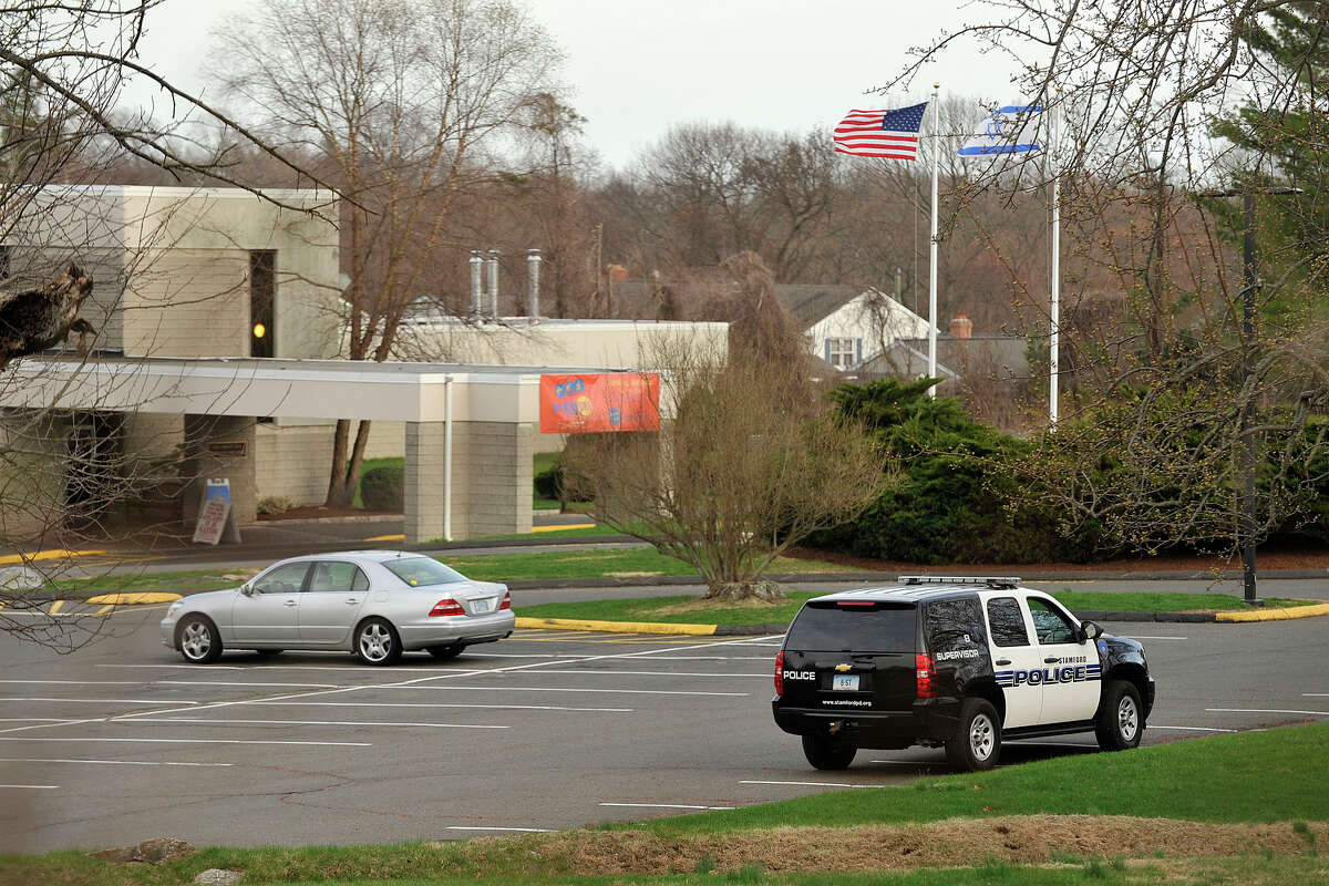 A Stamford Police vehicle sits outside the Stamford Jewish Community Center in Stamford, Conn., on Monday, April 14, 2014.