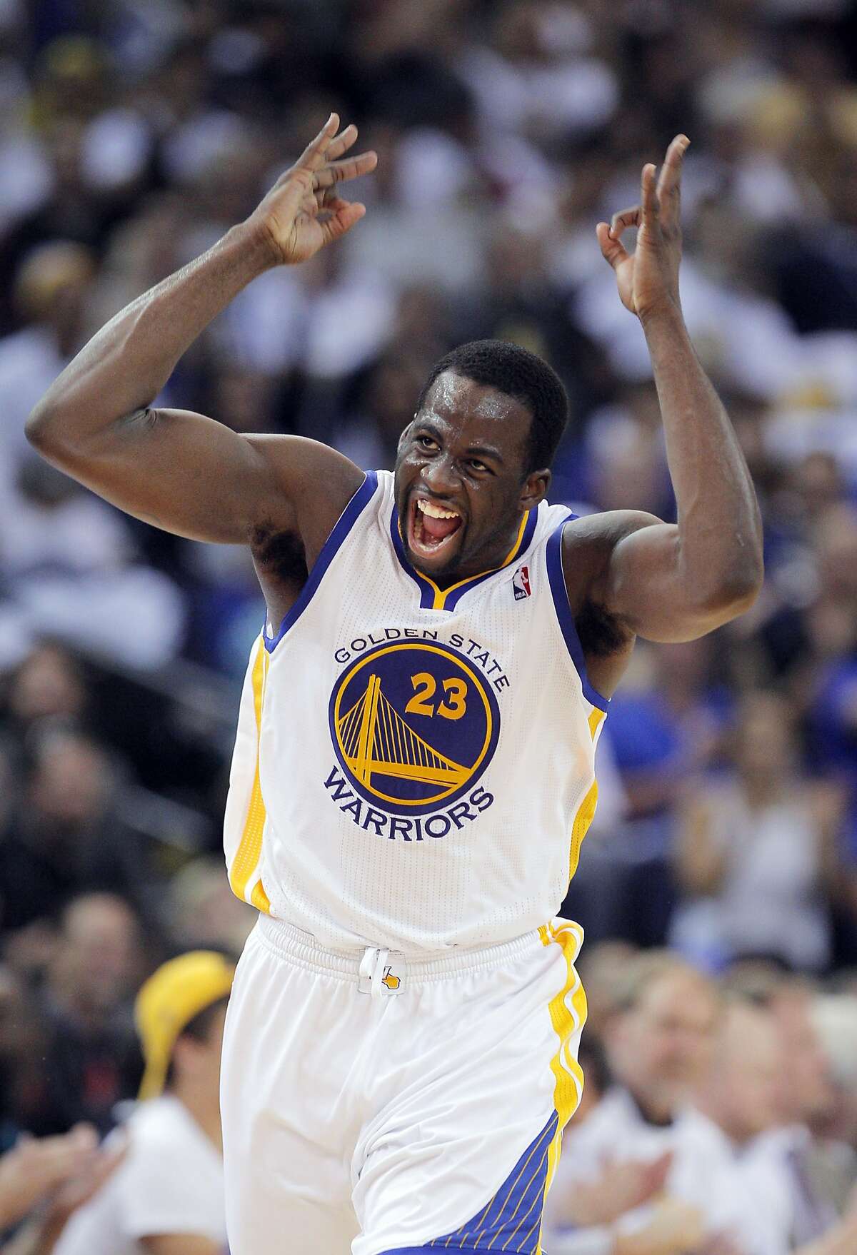 Draymond Green (23) reacts after hitting a three-point shot in the second half. The Golden State Warriors played the Minnesota Timberwolves at Oracle Arena in Oakland, Calif., on Monday, April 14, 2014.