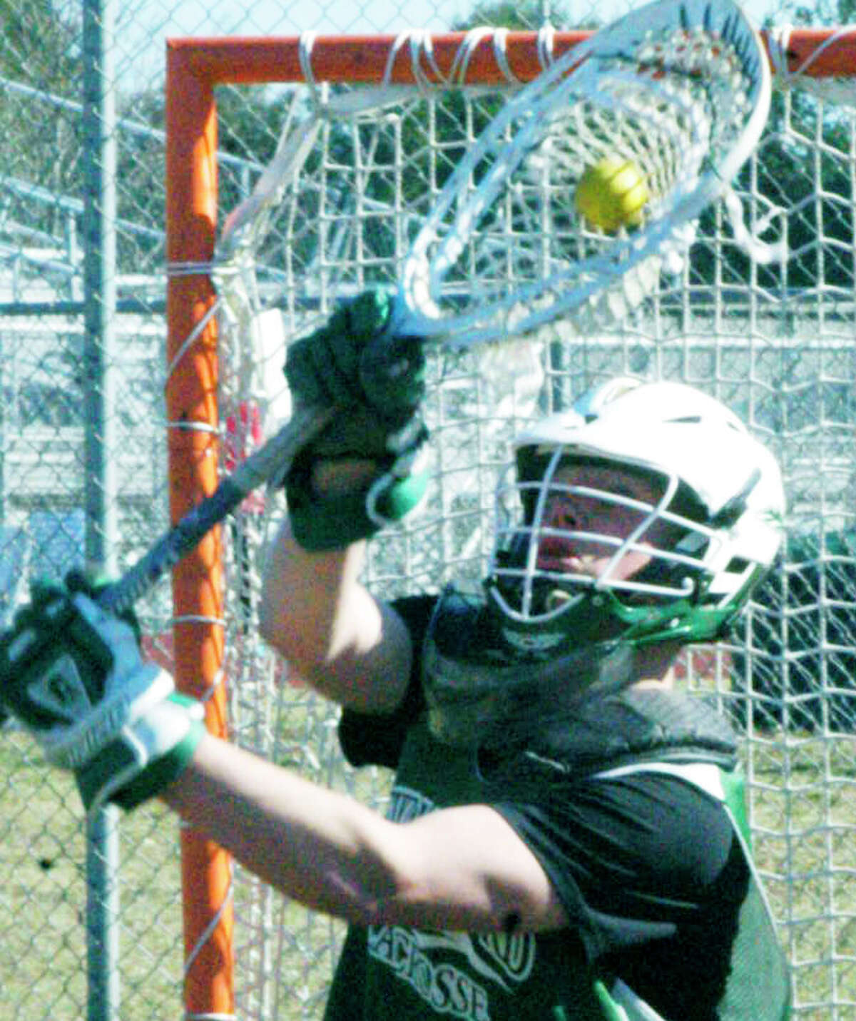 Green Wave senior Harrison O'Connell demontrates the quick hands that should allow him to make the transition to goaltender for New Milford High School boys' lacrosse this spring. April 2014
