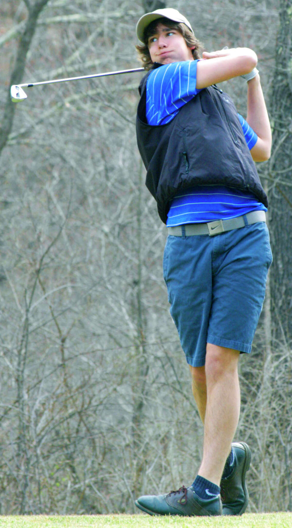 Rob McCarthy of the Spartans crafts his tee shot off the elevated 2nd tee at Washington Club during pre-season practice for Shepaug Valley High School golf. April 2014