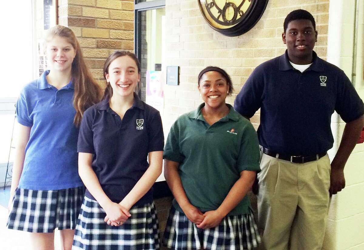 NOTRE DAME STUDENTS OF THE MONTH Notre Dame Catholic High School honored this quartet as its Students of the Month for March. From left are junior Michelle DeLeon, sophomore Alana Merly, senior Dy-Mond LeRoy and freshman Josh Jeudy. They were nominated by faculty based on attitude, community service and academic achievement.